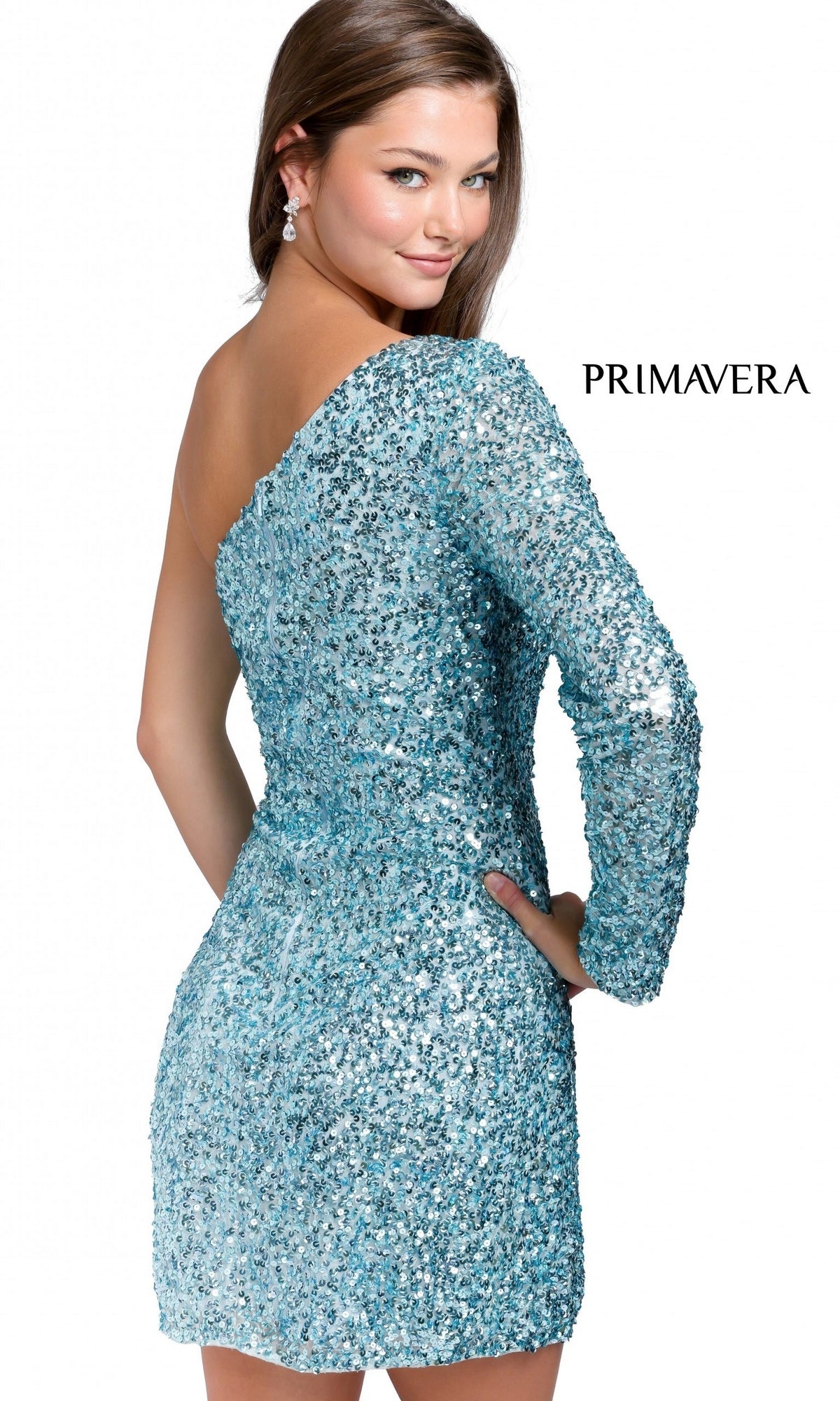 A woman poses with hand on hip in a sparkly light blue Faux-Wrap Beaded One-Sleeve Mini Party Dress 3860, featuring an asymmetrical neckline, with